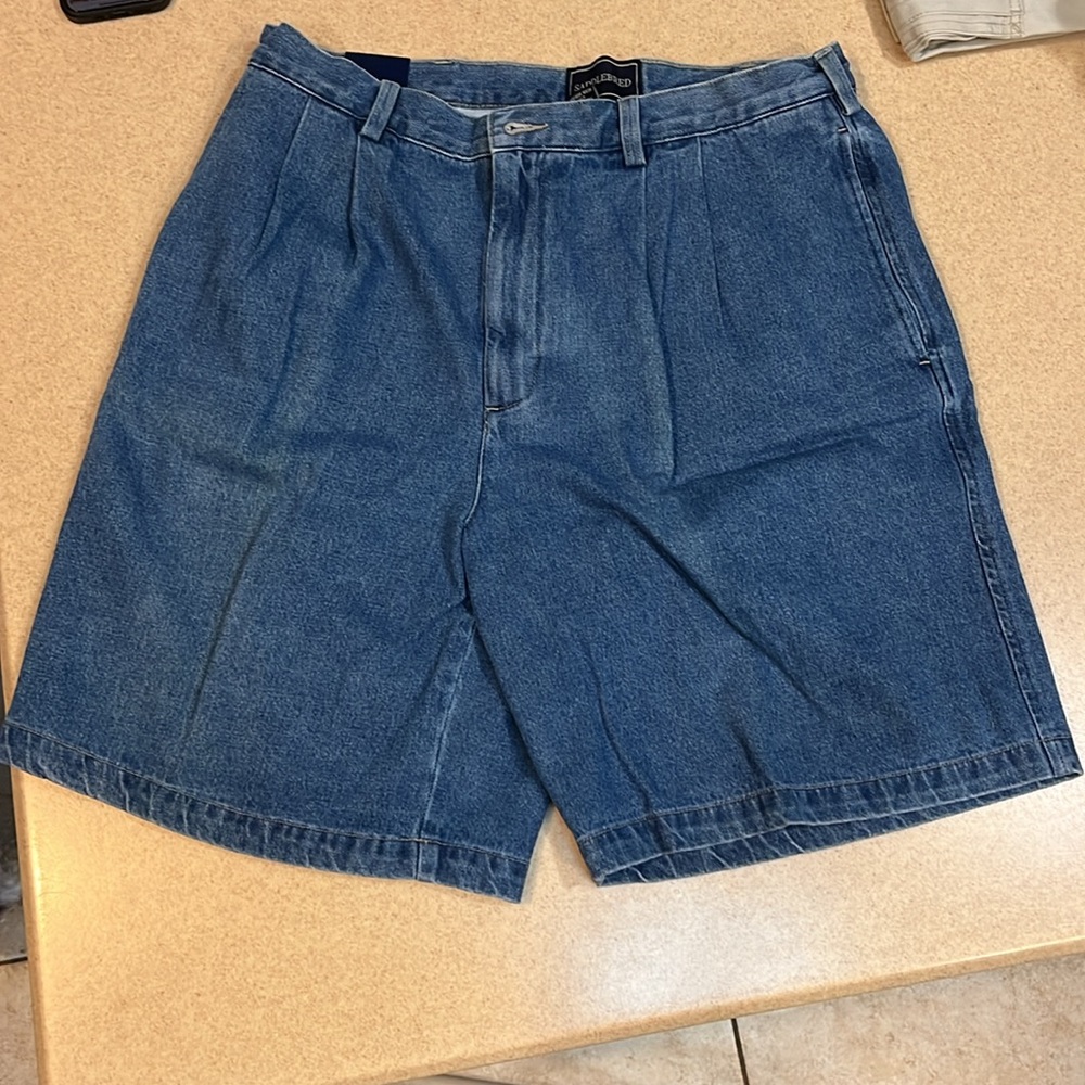 Men’s pleated jean shorts.  New with tags, never worn size 34